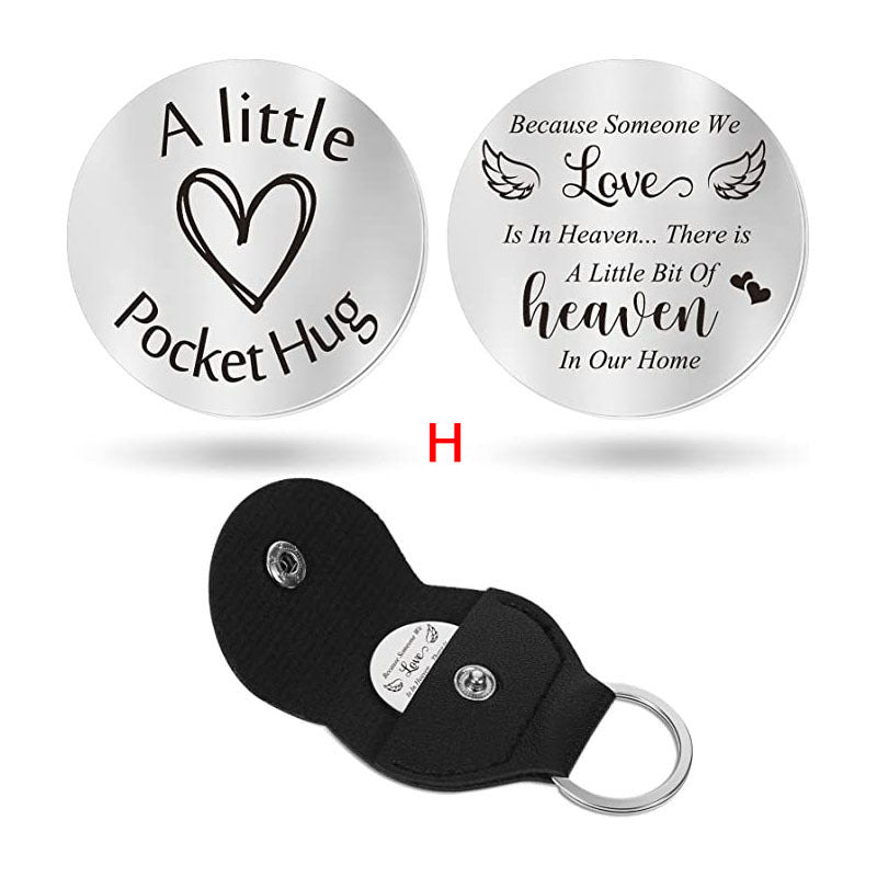 A small pocket Hug engraved key chain round stainless steel metal accessories