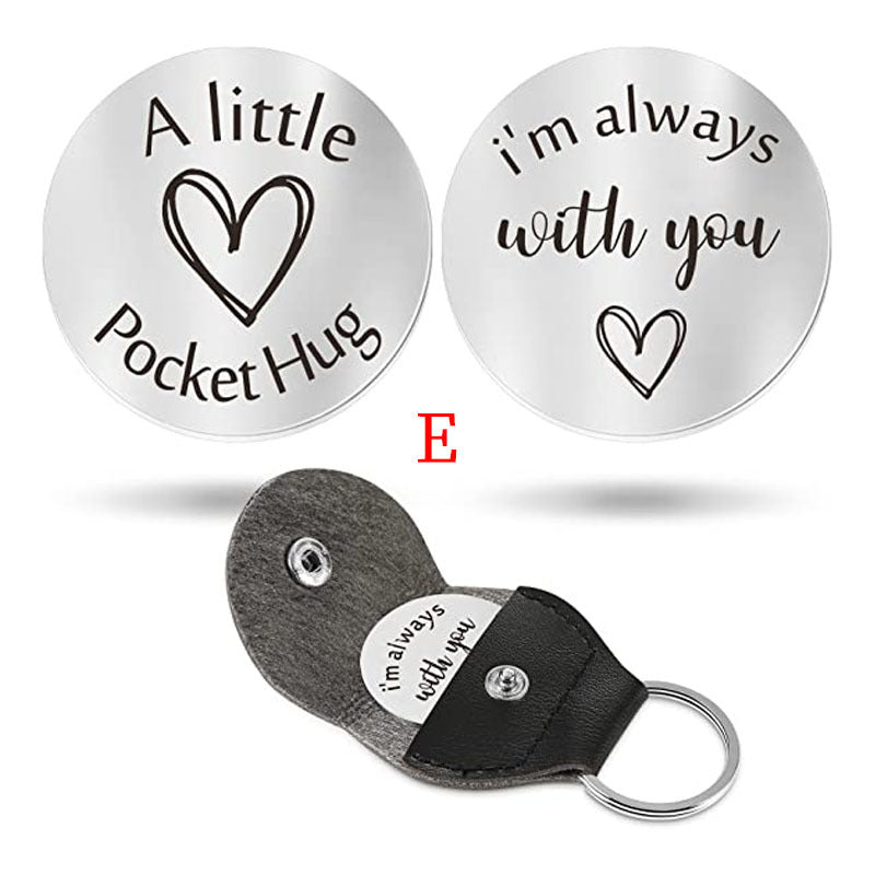 A small pocket Hug engraved key chain round stainless steel metal accessories