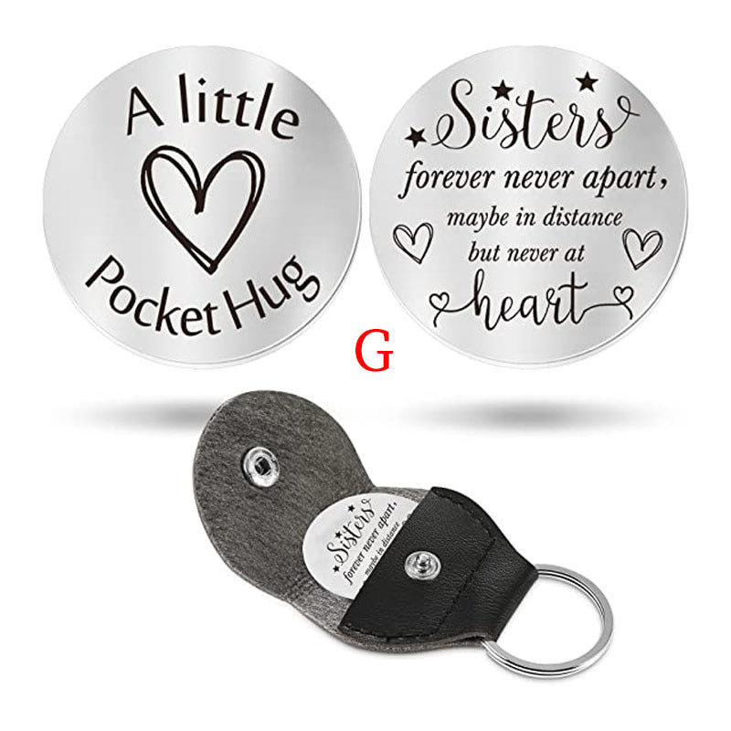 A small pocket Hug engraved key chain round stainless steel metal accessories