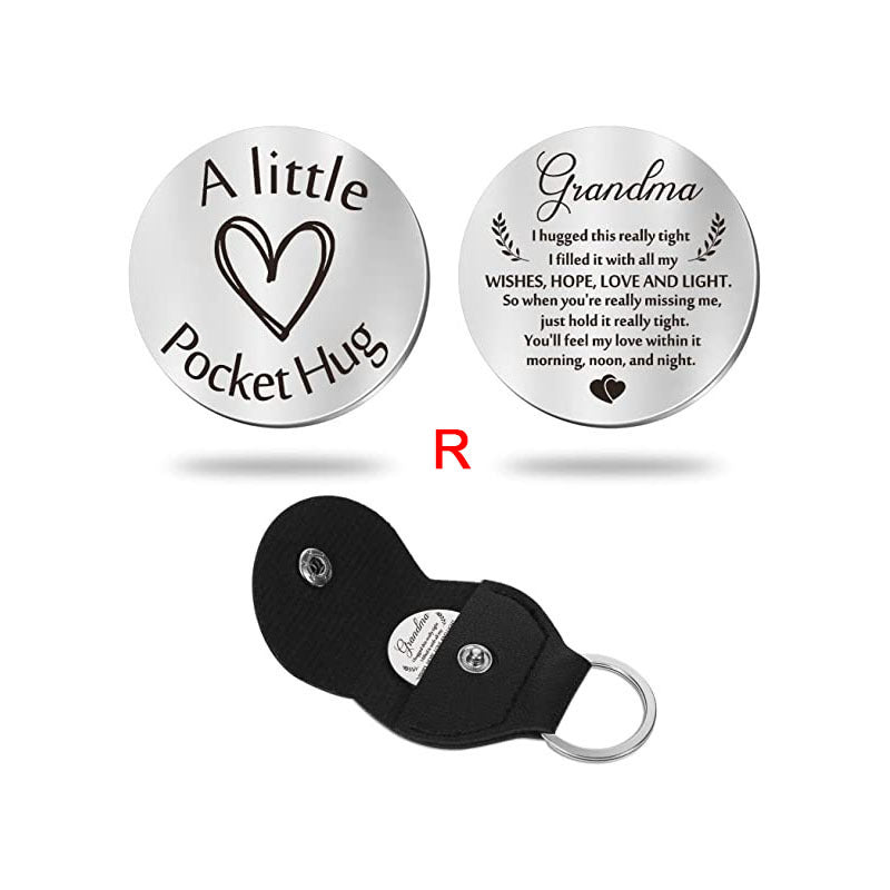 A small pocket Hug engraved key chain round stainless steel metal accessories